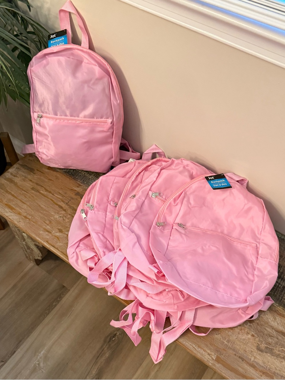 Bulk set of 10 New Light pink small nylon backpacks. Adjustable straps